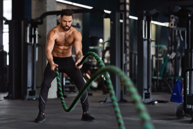 fitness-man-working-out-with-battle-ropes-at-gym.jpg