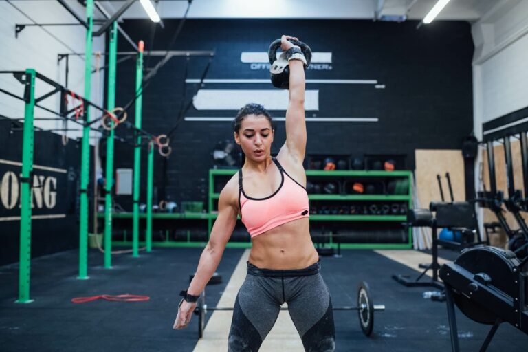 young-woman-training-swinging-kettlebell-indoor-in-a-crossfit-gym.jpg